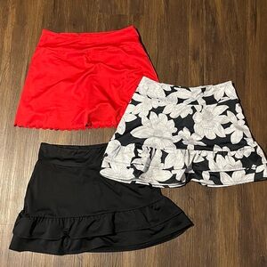 4 medium woman’s skorts. 1 NWT, 3 like brand new. Very comfy & stretchy!